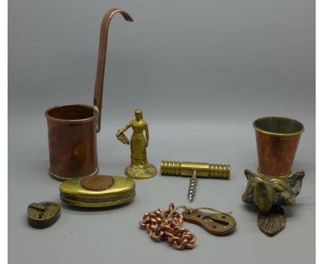 Nine items of brass and copperware including a brass fox door knocker and stirrup cup 