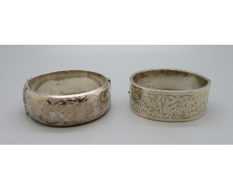 A hallmarked silver bangle and a c1900 bangle, total weight 69g 