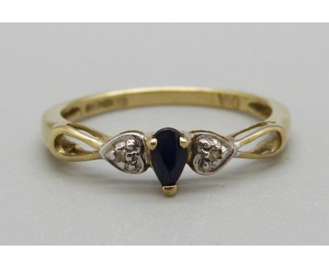 A 9ct gold three stone diamond and sapphire ring, 1.4g, O 