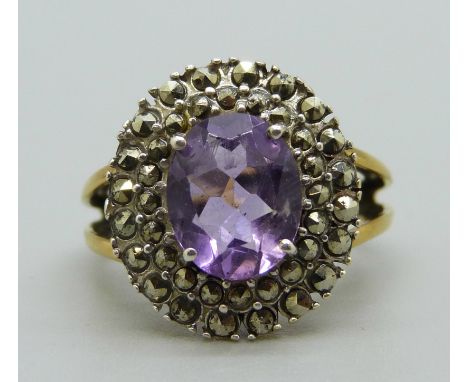 A silver gilt, amethyst and marcasite cluster ring, O 