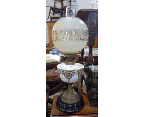 A VICTORIAN OIL LAMP with opaline reservoir and etched shade