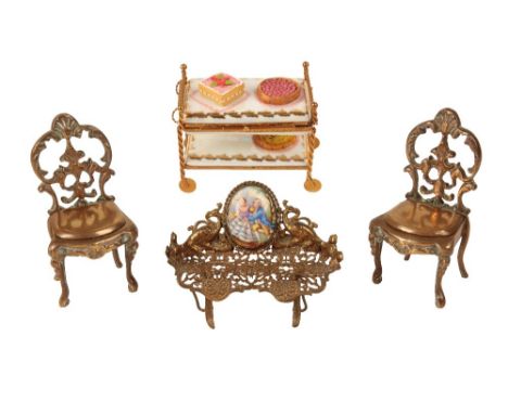 A LIMOGES AND GILT METAL ETAGERE modelled with desserts, a pierced gilt metal and enamel sofa and two chairs (4)