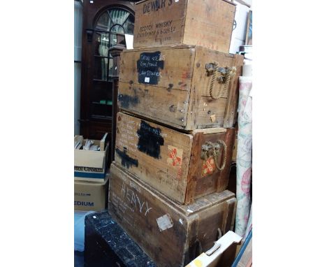 A VINTAGE DEWAR'S WHISKY CRATE, three other packing crates and a painted trunk