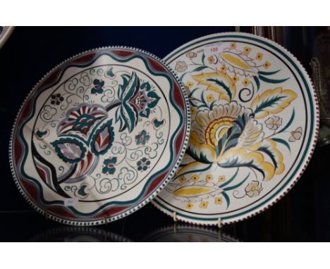 A POOLE POTTERY WHITE BODIED TRADITIONAL CHARGER, decorated in the EC pattern, 35cm dia, and one other, decorated in the ZB p