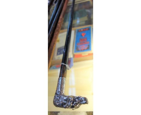 A WALKING STICK with silver  plated band and dog's head handle, 93cm high