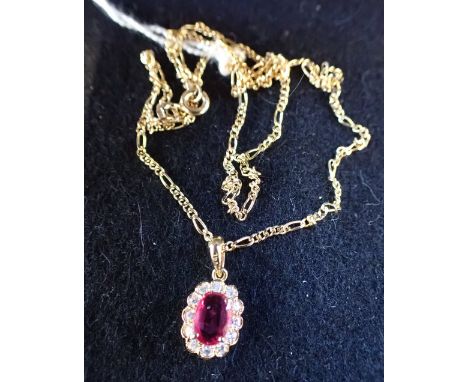 RUBY AND DIAMOND PENDANT, in an 18k gold setting on an a 9ct gold chain