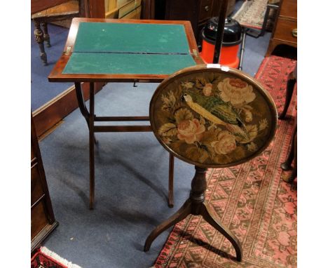 AN EDWARDIAN MAHOGANY FOLDING CARD TABLE and a pole screen (2)