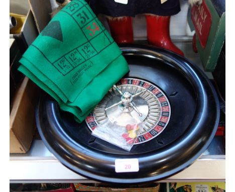 CHAD VALLEY; A VINTAGE BLACK BAKELITE ROULETTE WHEEL, 19cm dia and a green baize gaming mat with counters