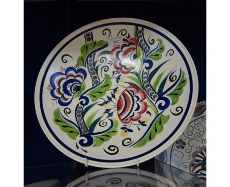 A POOLE POTTERY STUDIO CHARGER, decorated in the traditional pallet, painted and decorated by Sue Pottinger, painted and prin