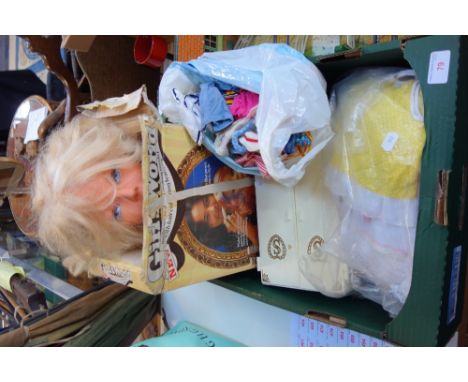 A VINTAGE 'GIRL'S WORLD' (boxed), a Sindy wardrobe and a collection of Sindy clothes and similar