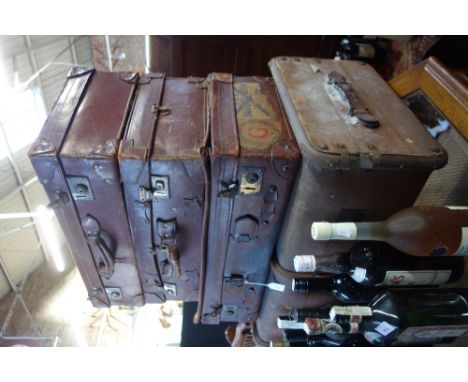 A VINTAGE LEATHER SUITCASE, two others and a canvas covered trunk