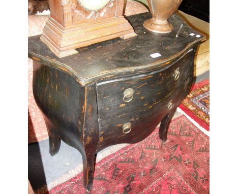 A REPRODUCTION BOMBE COMMODE of small proportions with distressed paint finish, 80cm wide