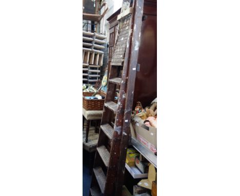 A VINTAGE WOODEN SIX RUNG STEP LADDER