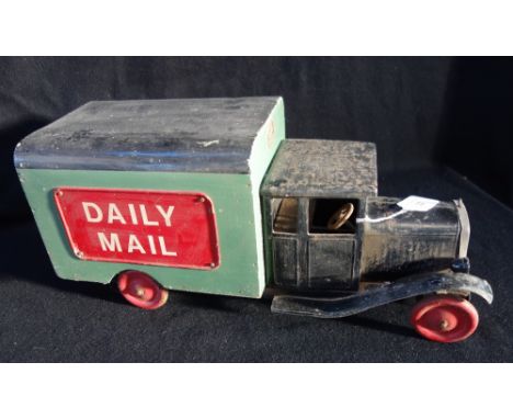 A VINTAGE 1930S 'DAILY MAIL' TINPLATE VAN with a green and black wooden body, reg number XC 8025, 49cm long
