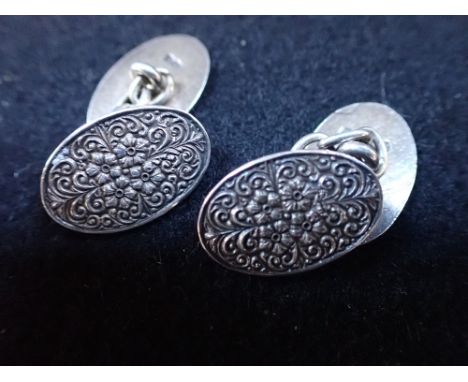 CHARLES HORNER SILVER CUFFLINKS, of oval embossed form, with chain connections
