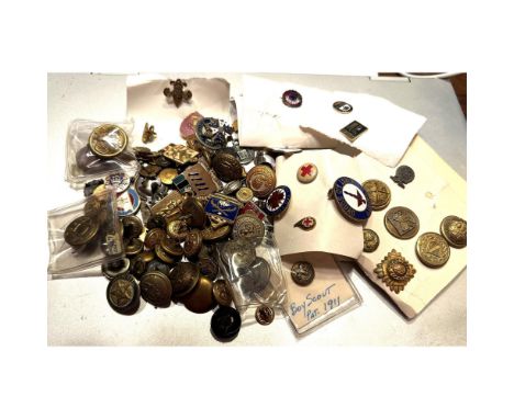 A good bag lot of military and uniform including pins and badges. This varied lot includes 19th century buttons as well as 20