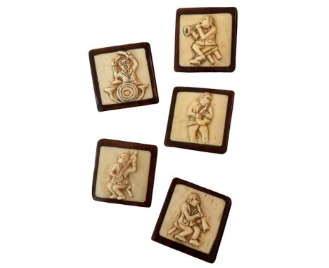 5 Large 21st century buttons with Musicians on them. This set of carved bone set in wood is the complete set of buttons that 