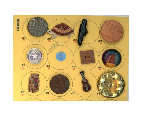 11 Medium &amp; Large19th-21st century buttons including tooled. This card includes some really nice examples like the emboss