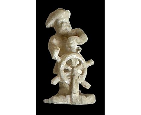 1Medium 21st century carved realistic ships captain at the wheel. This unusual and fun button is carved of what appears to bo
