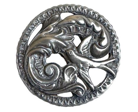 1 Large early 20th century button of a bird and foliage. The design of this button is reminiscent of the Art Nouveau designs 