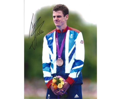 Olympics Johnny Brownlee signed 10x8 colour photo pictured with his bronze medal at the 2012 London games. Jonathan Callum Br