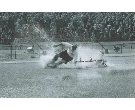 Football Sir Tom Finney signed 12x8 colour photo picturing the iconic splashdown image. Sir Thomas Finney CBE (5 April 1922 -