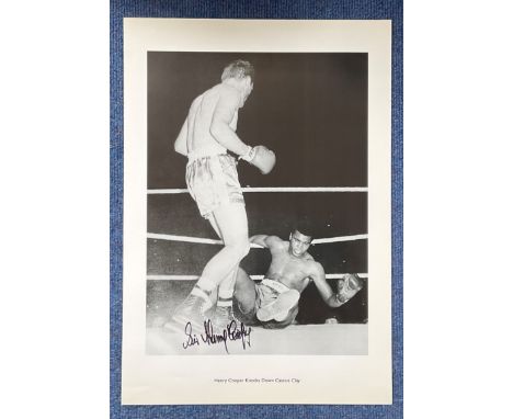 Boxing Sir Henry Cooper 20x14 signed black and white print picturing the iconic moment in 1963 when Henrys hammer knocked dow