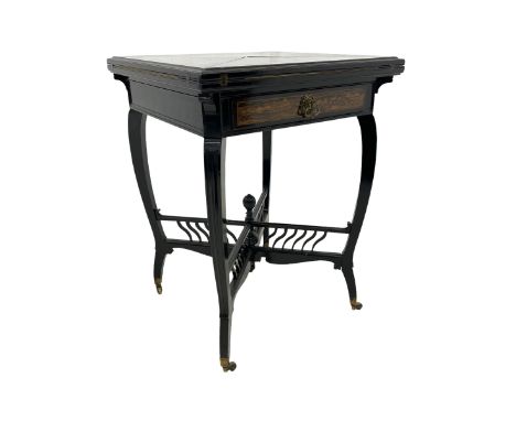 Late Victorian Coromandel wood and ebonised envelope card table, moulded swivel quadruple hinged top enclosing baize lined in