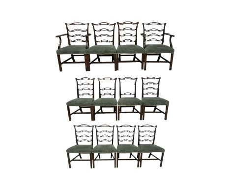 Set of twelve (10+2) Chippendale revival stained beech dining chairs, pierced waived ladder backs with over-stuffed over seat