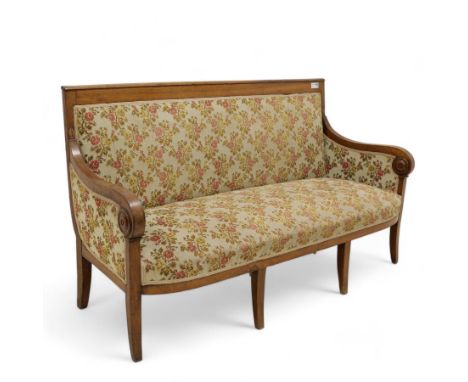 19th century walnut settee, upholstered in floral pattern fabric, scrolled arms with applied turned roundels, on square taper