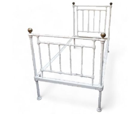 Victorian white painted cast iron 3' single bedstead, brass finials over floral moulded spindles, on castorsDimensions: Heigh