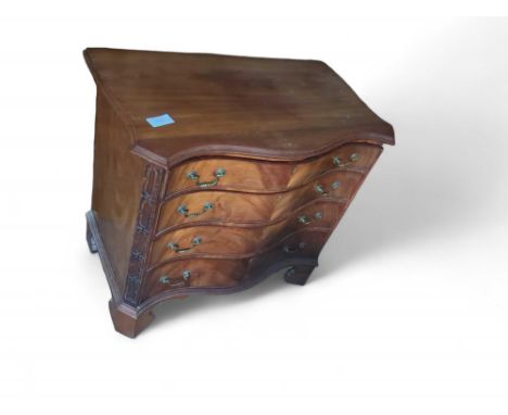 A small 20th-century mahogany and double-ogee-fronted chest of four long drawers of increasing size descending, with brass sw