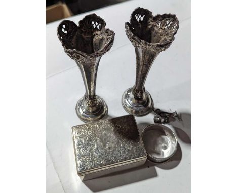 A small silver box, a silver napkin ring and a pair of weighted silver flower vases. The silver of different makers but all m