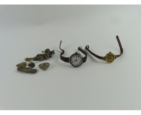 An ESEF watch face, the case marked '14kt', a silver cased early 20th century wristwatch, a silver graduated Albert chain, an