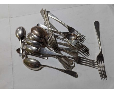 A large collection of silver flatware, comprising four soup spoons, four table spoons, five small forks, three table forks an