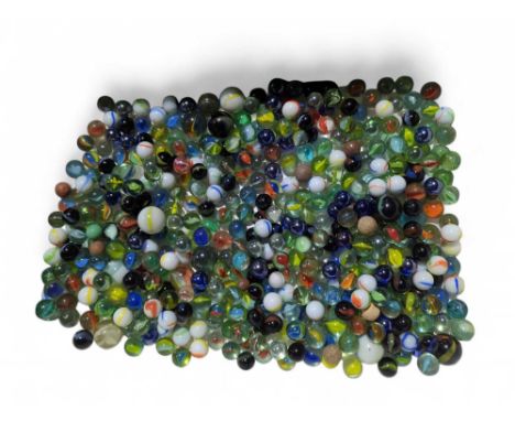 A large collection of glass marbles, largely 20th century, many with spiral twists