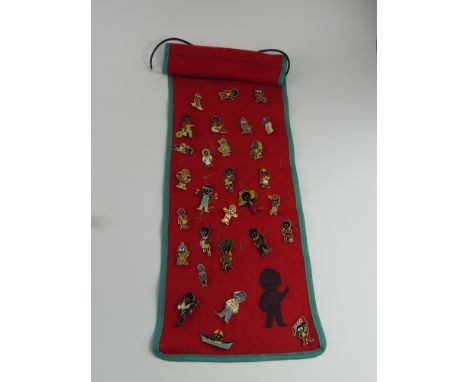A collection of Robertson's Jam advertising enamel pin badges on felt wall mount (These items are listed on the basis they ar