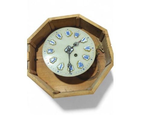 A late 19th/early 20th Century French wall clock in shaped wooden case having blue on white enamel Roman numerals, striking o