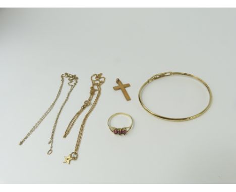 A 9ct gold bangle with Rennie Mackintosh style design, a cross marked '9ct', a small 9ct gold star pendant on a chain marked 