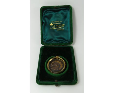 A continental open faced pocket watch, the highly decorated case marked '18k', 27.36g gross inclusive of movement, in a fitte