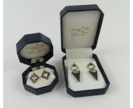 Nicholas Wylde - a pair of silver and slate contemporary design earrings, 3.9cm long; and another pair of open square form wi