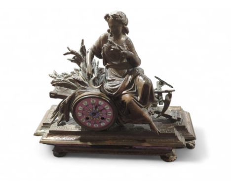 A French 19th Century mantel clock by Marti et Cie, in bronzed spelter case surmounted with a lady holding a sickle with corn