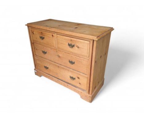 A 20th-century pine chest of two short and two long drawers, with brass swing handles and upon simple bracket feet. 85cm tall