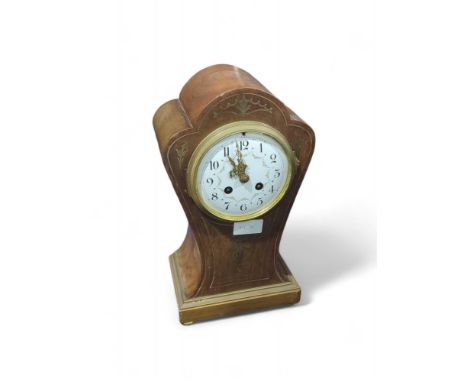 An Edwardian mantel clock having white enamel dial painted with floral swags and in brass inlaid mahogany case, 32cms high