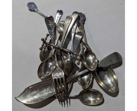 A collection of silver flatware and cutlery, comprising thirteen spoons of various designs and sizes, one fork, one fish knif