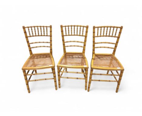 A set of three early 20th Century painted bamboo chairs with cane seats (3)