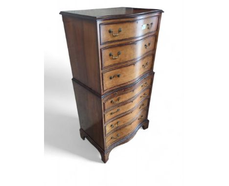 A late-19th/early-20th-century bow-fronted chest on chest, in total with seven long drawers of different sizes. With brass sw