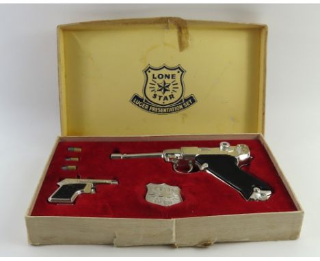 A boxed Lone Star 'Luger Presentation Set'; the toy cap gun set comprises of a chrome plated Lone Star "Luger" cap pistol wit