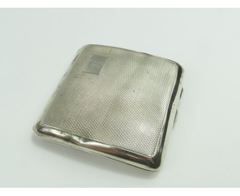 A small silver cigarette case with wavy decoration around body. Made by E J Trevitt & Sons in Chester 1936. 2.85 Troy oz