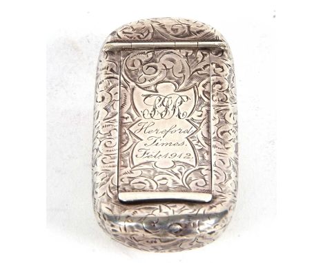 An Edwardian silver snuff box with rectangular body with a slightly curved profile, chased and engraved all over with scrolls